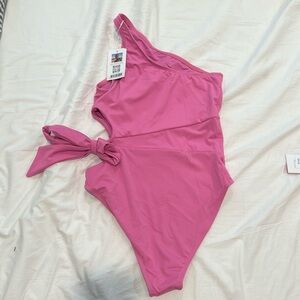 Brand new with tags pink medium one piece swim suit with cute side opening
